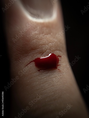 Extreme Close-Up of an Index Finger with a Fake Cut, with a Small Bit of Blood