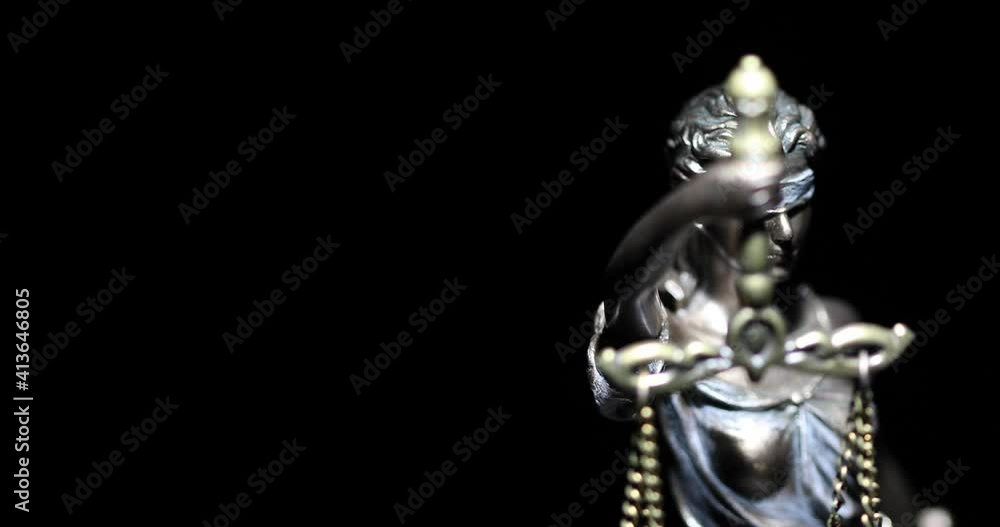 4k Spot Lit Lady Justice Statue Slowly Rotating on Black Background. 4k Spot Lit Lady Justice Statue Slowly Rotating on Black Background.