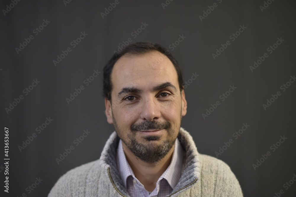 Spanish man with black hair and with beard and smile Spanish man with black hair and with beard and smile