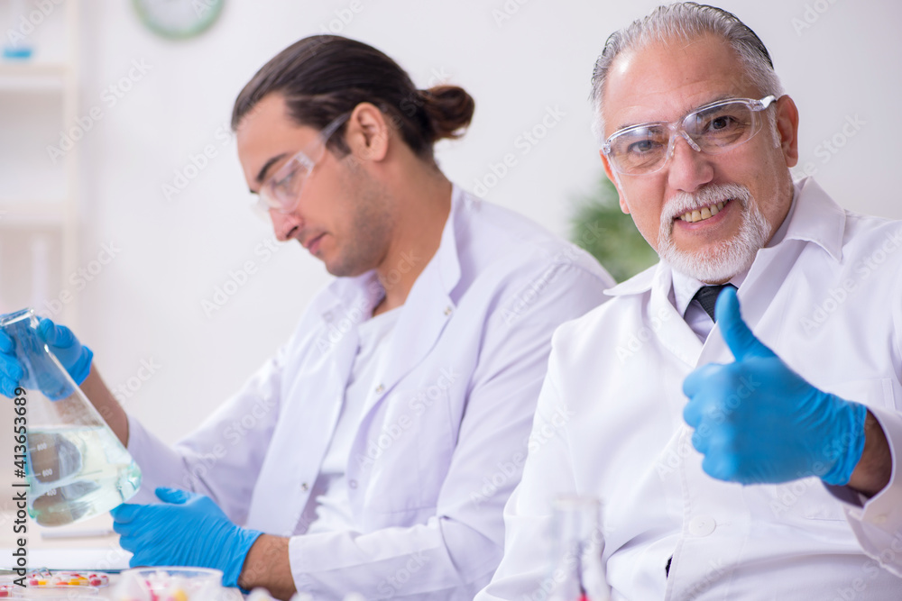 Two chemists working in the lab Two chemists working in the lab
