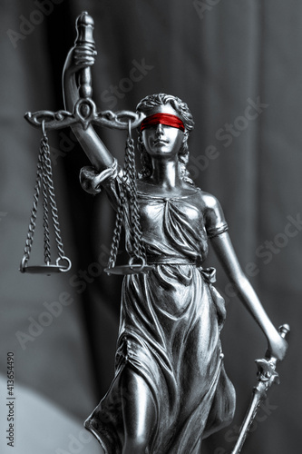 Lady Justice black and white with red blindfold. Symbol of law or lawyer.