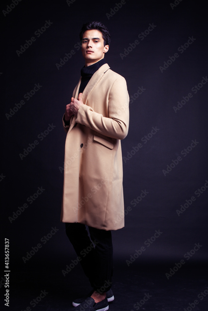 handsome asian fashion looking man posing in studio on black background, lifestyle modern people concept handsome asian fashion looking man posing in studio on black background, lifestyle modern people concept