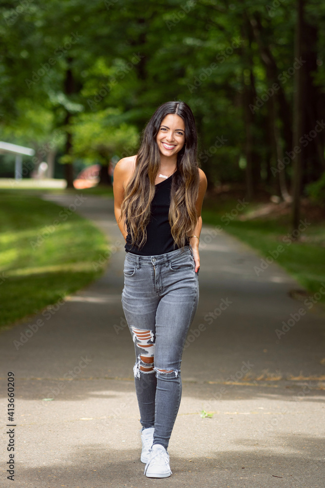Portrait of a beautiful smiling young woman in the park Portrait of a beautiful smiling young woman in the park