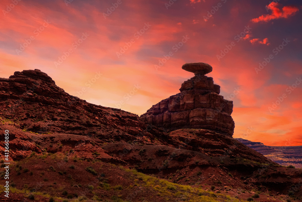 The Mexican Hat rock formation in Utah, USA, enjoys a beautiful sunset while it welcomes people to the small southwestern town with the same name.