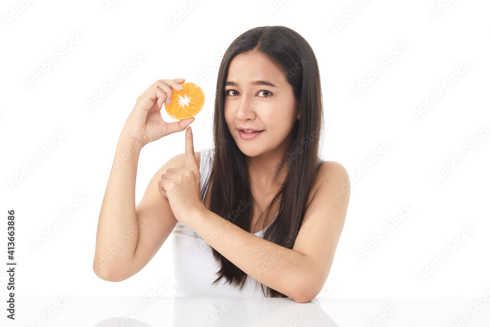 Portrait of a beautiful young woman with orange Portrait of a beautiful young woman with orange
