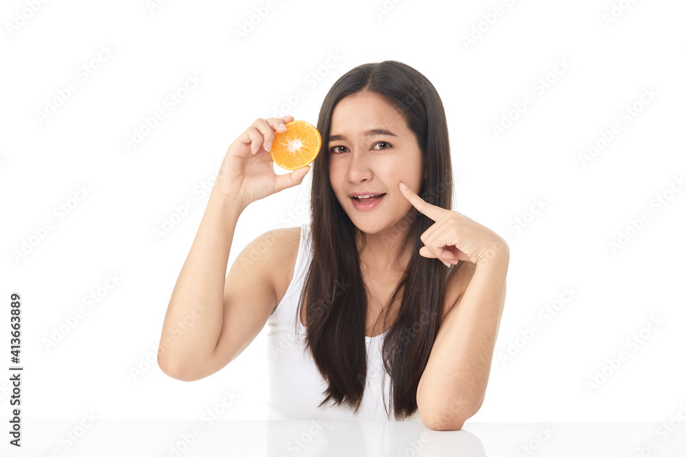 Portrait of a beautiful young woman with orange Portrait of a beautiful young woman with orange