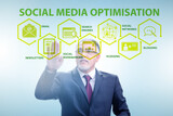 Social media optimisation concept with businessman