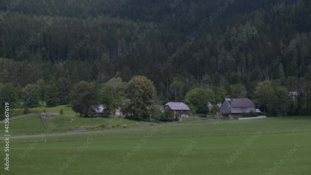 Traditional wooden rustic farmhouses in the Slovenian Alps with surrounding meadows, Zgornje Jezersko, Slovenia Traditional wooden rustic farmhouses in the Slovenian Alps with surrounding meadows, Zgornje Jezersko, Slovenia