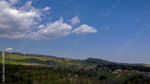 Aerial view of moving clouds above vineyards of Slovenia, hyper, time lapse from above, rural landscape of Ritoznoj near Slovenska Bistrica photo