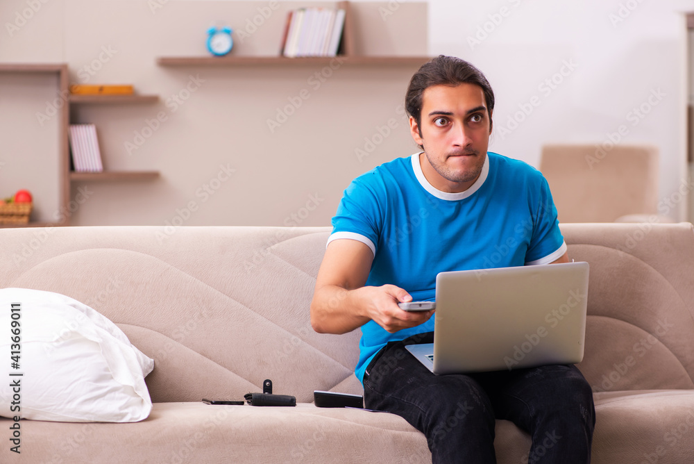 Sport bet addicted young man betting at home Sport bet addicted young man betting at home