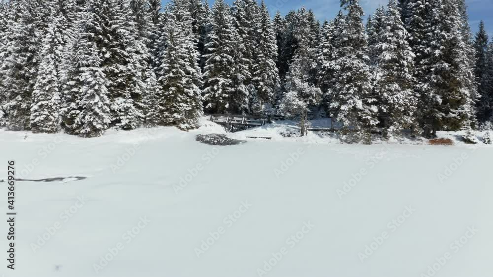 Revealing aerial view of frozen and snow covered lake in winter, Black Lake or Crno jezero on Pohorje, Slovenia near Rogla ski resort, nobody Revealing aerial view of frozen and snow covered lake in winter, Black Lake or Crno jezero on Pohorje, Slovenia near Rogla ski resort, nobody