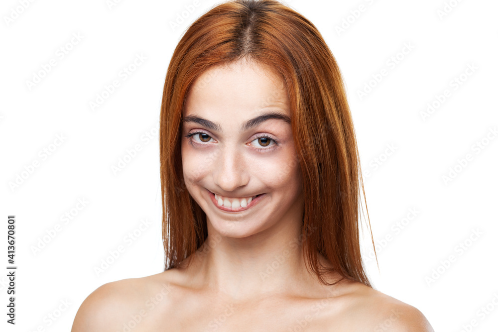 Happy red hair girl making funny face expressions. Studio portrait on white background Happy red hair girl making funny face expressions. Studio portrait on white background