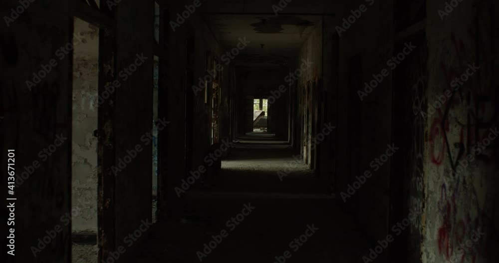Walkthrough shot of an vandalized hallway in an abandoned building Walkthrough shot of an vandalized hallway in an abandoned building