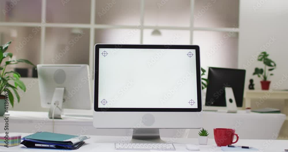 View of computer screen and office supplies on desk at office View of computer screen and office supplies on desk at office