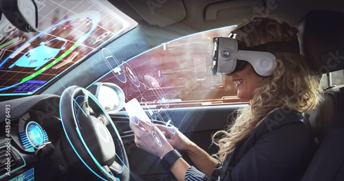 Animation of digital interface over woman wearing vr headset in in self driving car photo