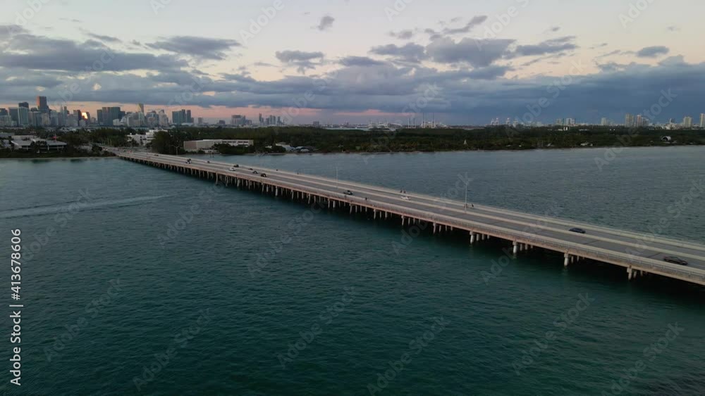 Aerial drone view of traffic on the Bear Cut Bridge, sunset, in Miami, Florida Aerial drone view of traffic on the Bear Cut Bridge, sunset, in Miami, Florida