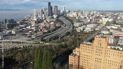 Cinematic aerial drone footage of Pacific Tower, First Hill, Yesler Terrace, Atlantic, Cherry Hill, Squire Park, I-5 I-90 freeway interchange, International district, Chinatown in downtown Seattle photo