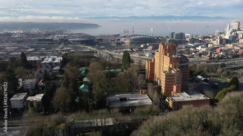 Cinematic aerial drone shot of Pacific Tower on Beacon Hill, SODO, Skyhawks, Mariners stadiums, T-mobile Park, Centurylink Field, Lumen Field, International district, Chinatown in Seattle, Washington photo