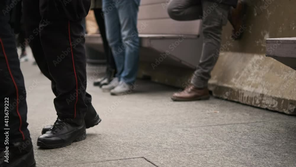 Legs Of Carabinieri In Milan Italy, Military Police Force Wearing Boots Walking Outside On A Concrete Floor. - close up, slow motion Legs Of Carabinieri In Milan Italy, Military Police Force Wearing Boots Walking Outside On A Concrete Floor. - close up, slow motion