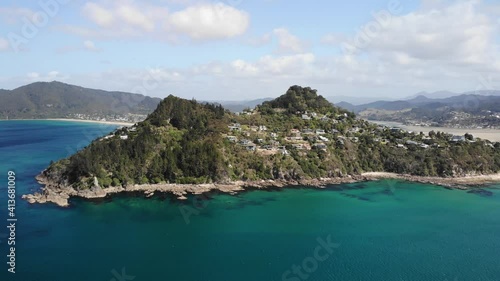 Aerial View of Mount Paku, Hill Above South Pacific Ocean Coast, Coromandel Peninsula, New Zealand. Orbit Drone Shot photo