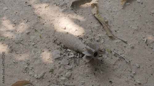 close up of unexploded ordnance (UXO) mortar on the ground
