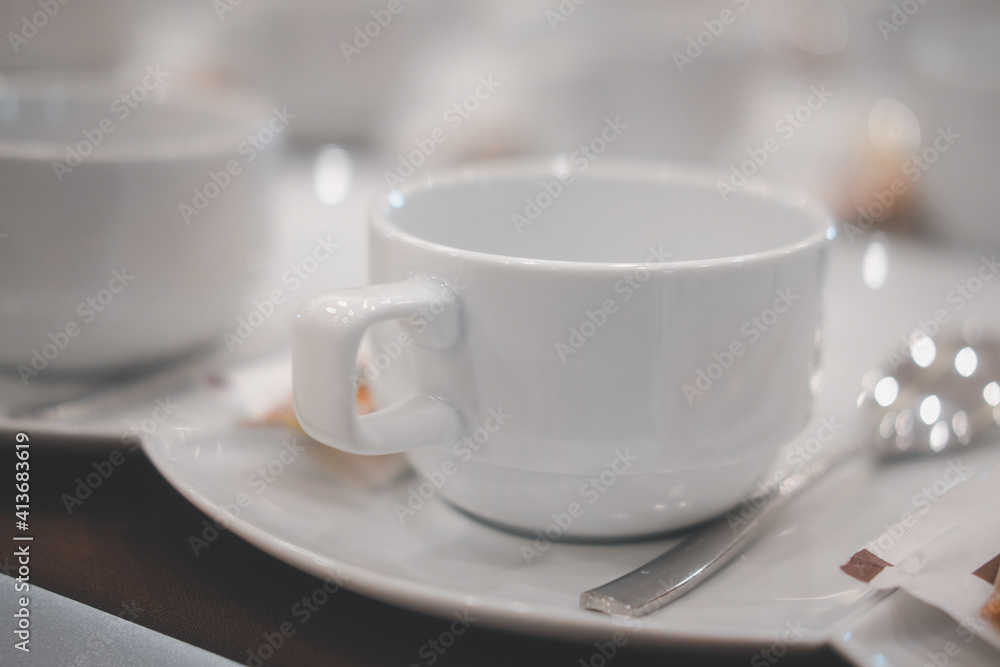 Empty cups of coffee in a row at conference hotel Empty cups of coffee in a row at conference hotel