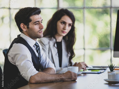 Φωτογραφία Side view portrait of a thoughtful young adult caucasian businessman sitting in a meeting, thinking how to solve company problems