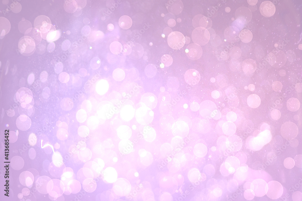 Abstract illustration of bokeh spots of light against purple background
