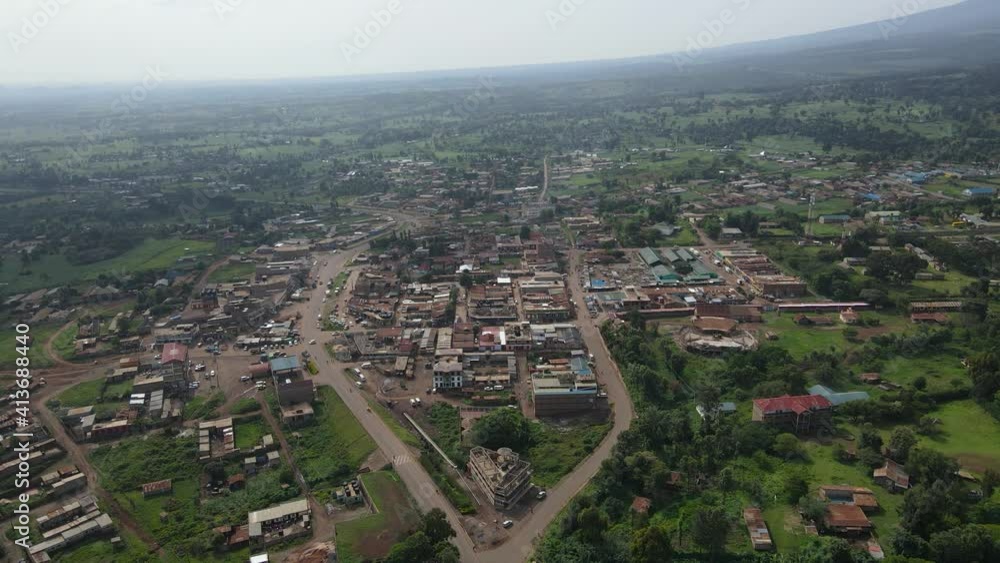 Panoramic View Of A Rural Townscape With Green Fields And Houses In Loitokitok, Kenya At Daytime - aerial drone shot Panoramic View Of A Rural Townscape With Green Fields And Houses In Loitokitok, Kenya At Daytime - aerial drone shot