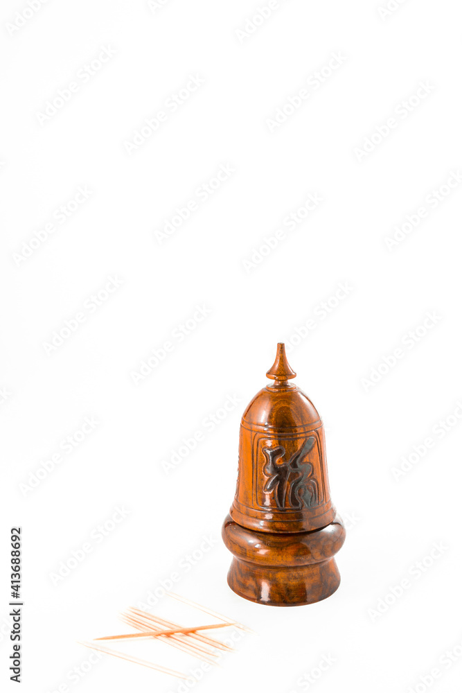 A toothpick holder close up on white background. A toothpick holder close up on white background.
