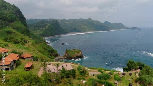 Paradise landscape of Javanese coast near Menganti Beach Indonesia, aerial dolly photo