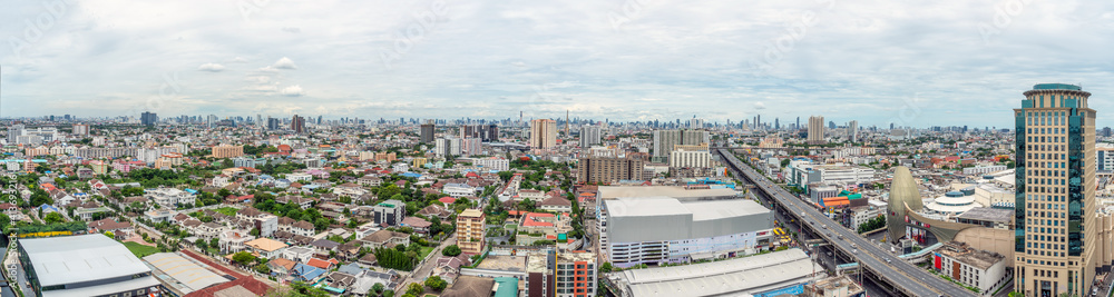 Bangkok panorama city view from high building. Bangkok skyline with local home, street and traffic.