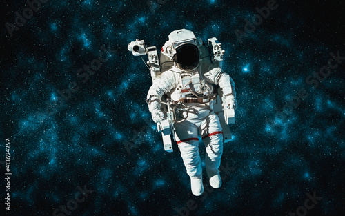 Astronaut spaceman do spacewalk while working for space station in outer space . Astronaut wear full spacesuit for space operation . Elements of this image furnished by NASA space astronaut photos. photo