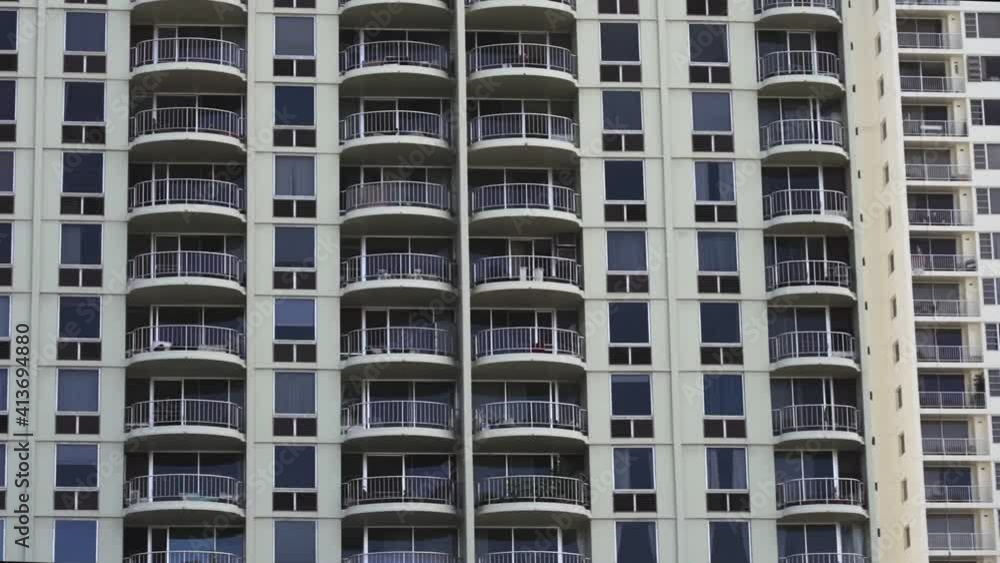 Facade of modern Resort building in Oahu Island, Hawaii - Medium long pan shot Facade of modern Resort building in Oahu Island, Hawaii - Medium long pan shot