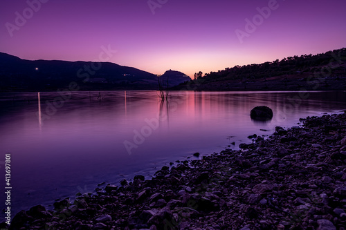 Sunset in a castle over a lake in a calm place