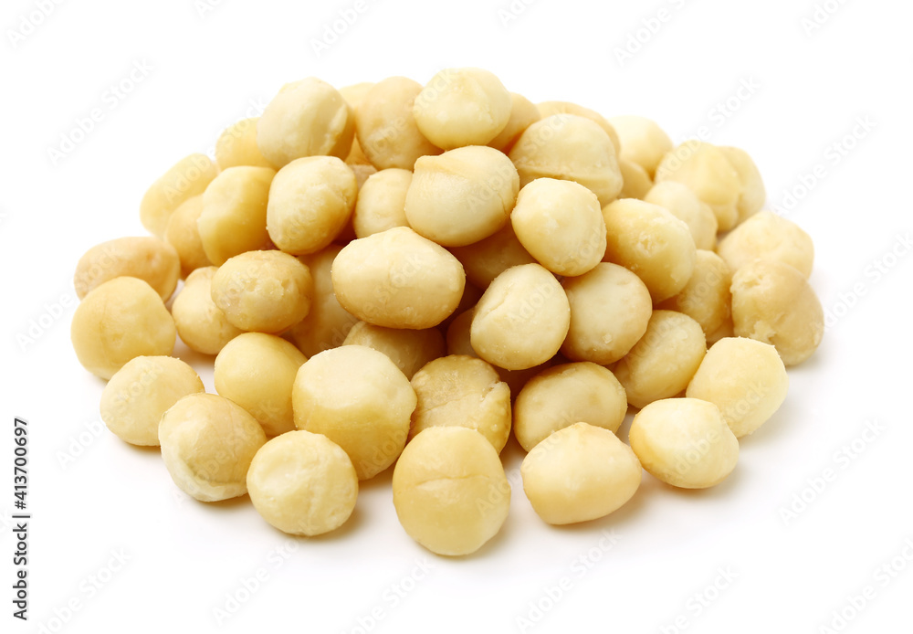Shelled and unshelled macadamia nuts on white background Shelled and unshelled macadamia nuts on white background
