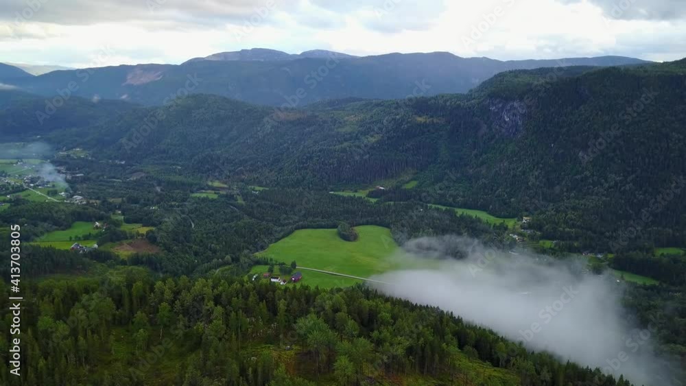 Flight over forest with clouds in Norway Flight over forest with clouds in Norway