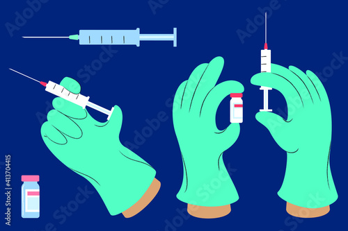a set of gloved hands holding syringes and vaccine vials