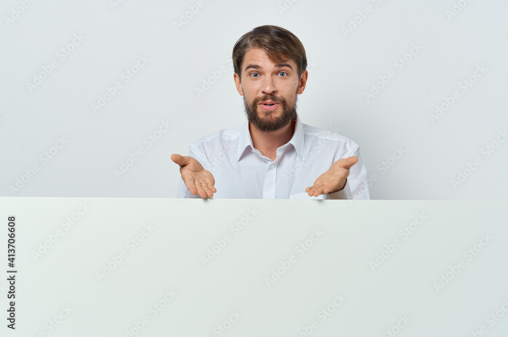 funny bearded man stands near the mockup advertising presentation funny bearded man stands near the mockup advertising presentation