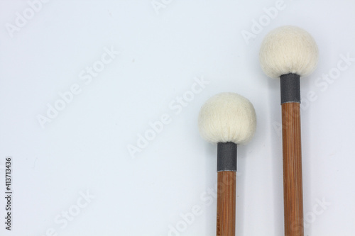 Timpani mallets in the right side on a white background.