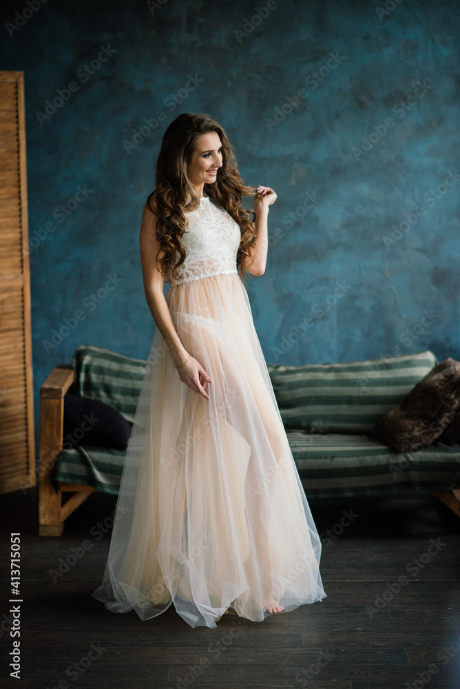 Beautiful bride in white lingerie sitting in her bedroom and studio. Beautiful bride in white lingerie sitting in her bedroom and studio.
