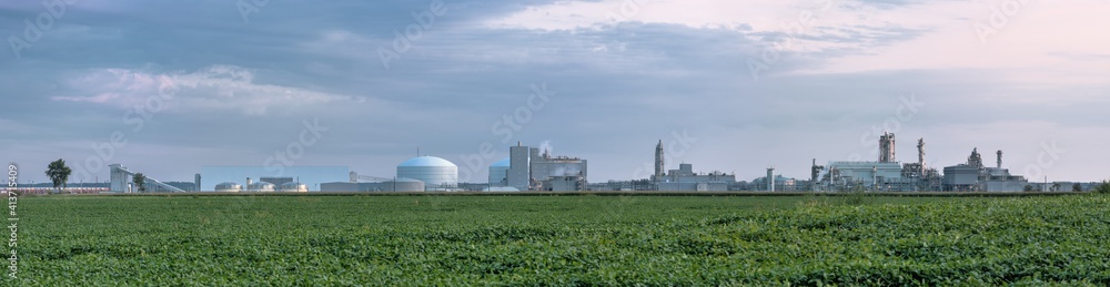 Fertilizer plant in an agricultural landscape. Corn and soybeans share acreage with a new manufacturing facility.