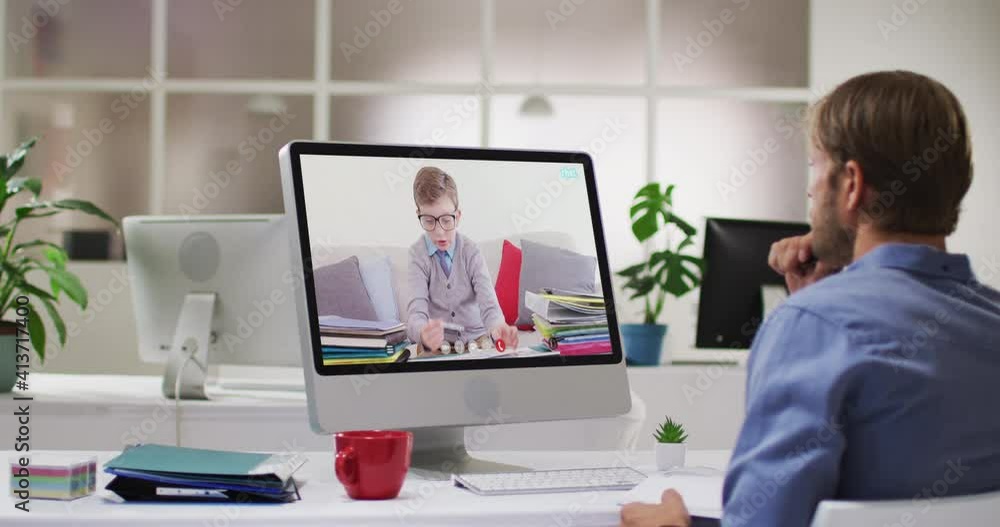 Caucasian male teacher using computer on video call with schoolboy Caucasian male teacher using computer on video call with schoolboy