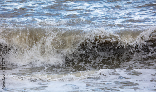 Wave on the seashore as a background. © schankz