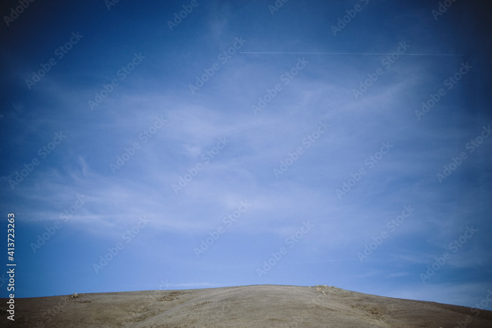 Scenic view of beach against blue sky Scenic view of beach against blue sky