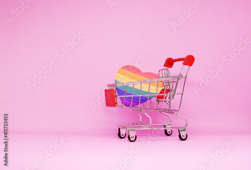 LGBT , LGBTQI Heart paper Pride flag color with Shopping cart on pink background - Love Pattern Sexual diversity - Lesbian gay bisexual transgender Queer Intersex - Shopping marketing target 