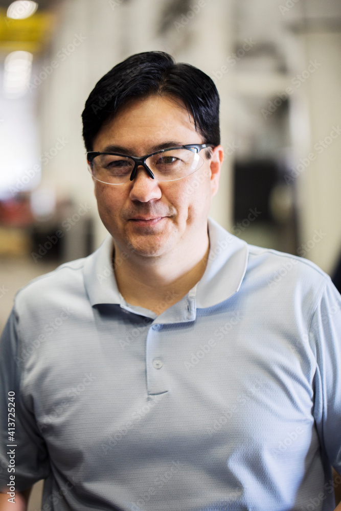 Portrait of confident supervisor wearing protective eyewear in metal Steel Industry Factory Portrait of confident supervisor wearing protective eyewear in metal Steel Industry Factory