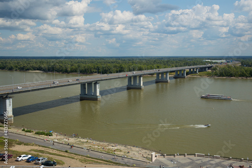 Wallpaper Mural Bridge over a wide river. The Ob River in Russia. A motor ship is sailing along the river. Torontodigital.ca