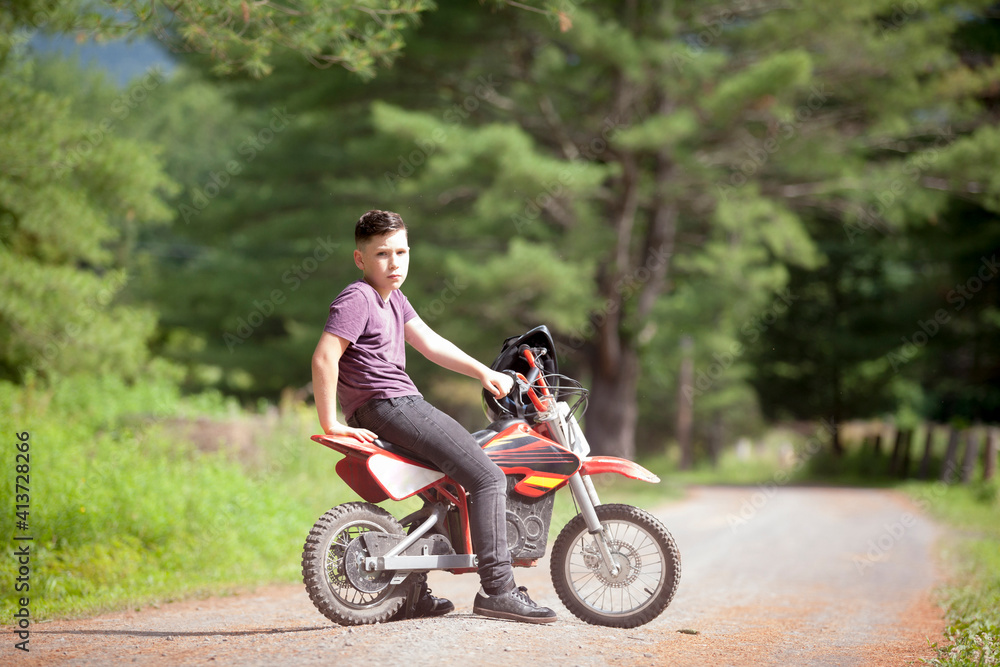Portrait of boy sitting on dirt bike Portrait of boy sitting on dirt bike