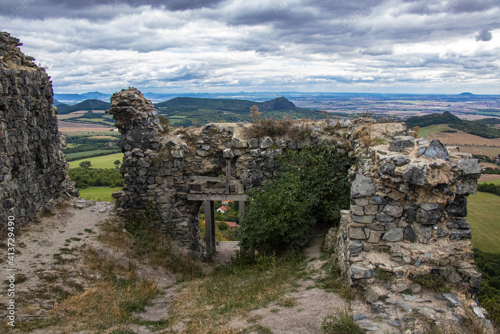 the ruins of an old castle and the top of a hill